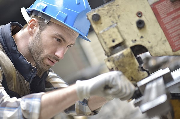 human male working with metal